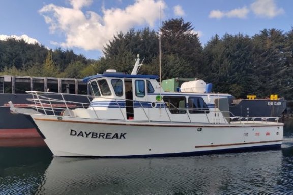 a boat is docked next to a body of water